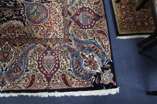 A Persian blue ground carpet, 13ft 1in by 9ft 8in.